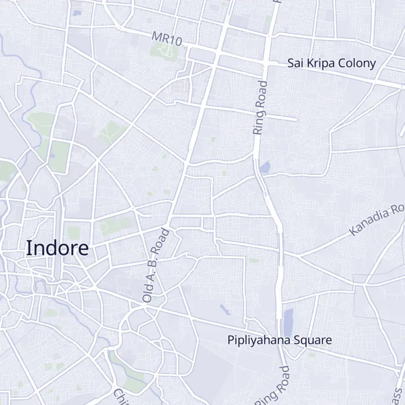 Street map of Indore with 12 numbered pins, one for each clinic in the list.
