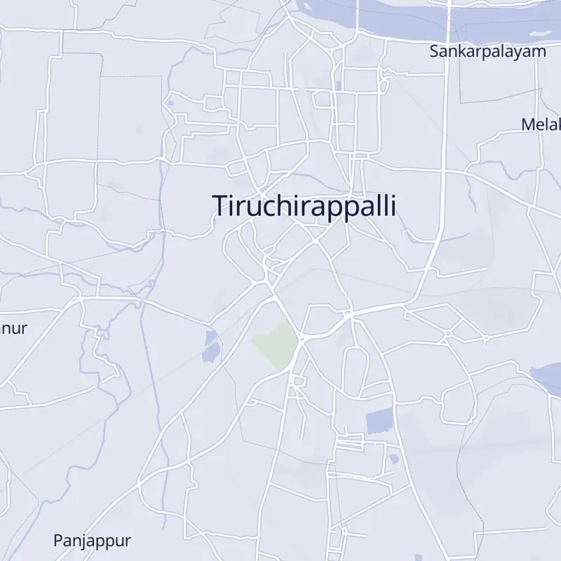 Street map of Trichy with 9 numbered pins, one for each clinic in the list.